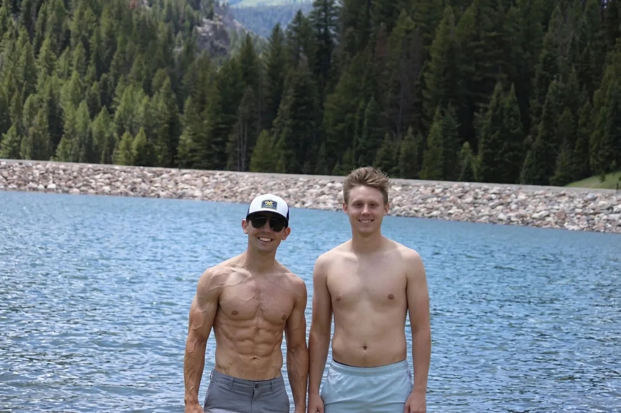 2 good looking guys by the lake
